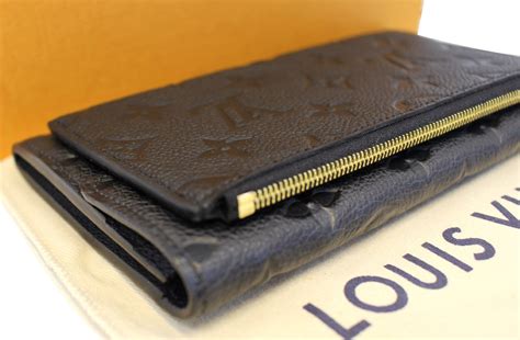 black monogram louis vuitton wallet.